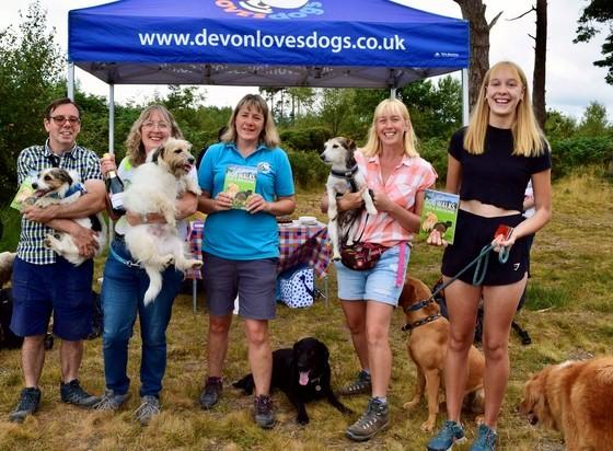 A photo of the Devon Loves Dogs gazebo and members celebrating its 5th birthday
