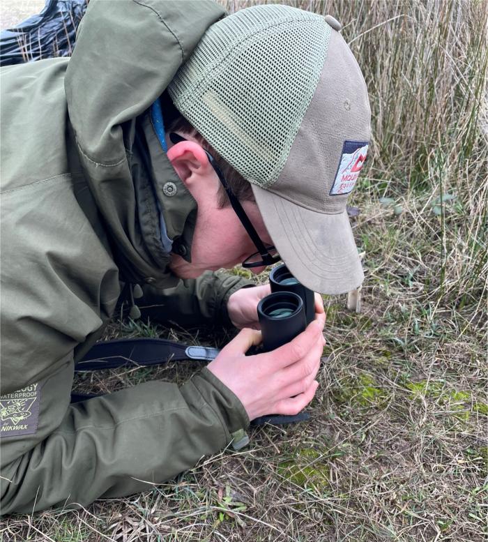 Caius looking for petalwort through binoculars